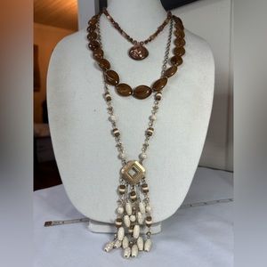 Three neutral tone layering style statement necklaces